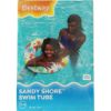 Obraz przedstawia opakowanie "Sandy Shore Swim Tube" z kobietą w fioletowym stroju kąpielowym i dzieckiem w kolorowej rurce do pływania w wodzie.