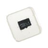 Obraz przedstawia przezroczyste plastikowe etui z włożoną czarną kartą microSD, na białym tle.